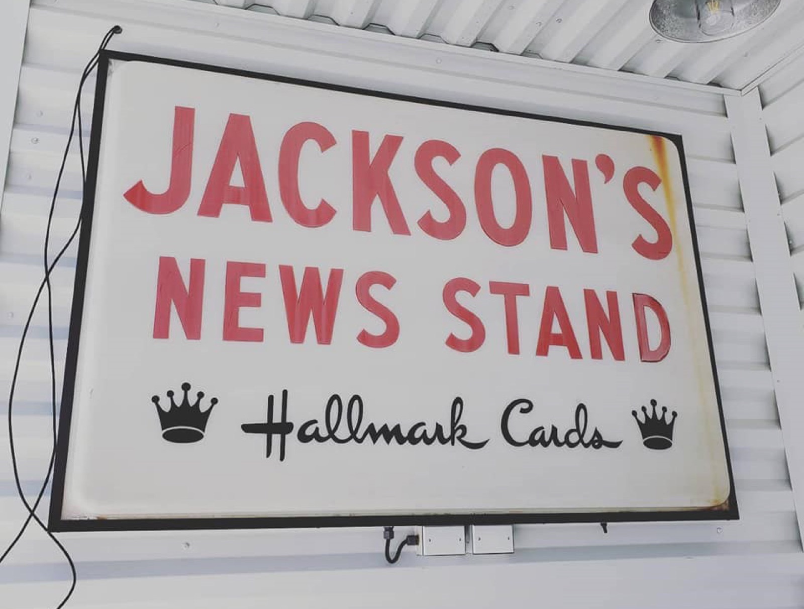 The original Jackson's News Stand sign, red lettering with Hallmark Cards crowns
