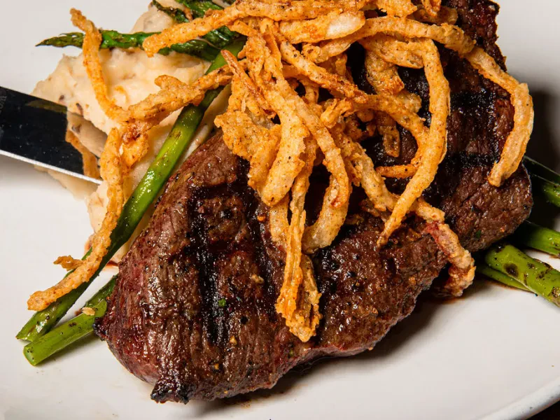 Hand-cut steak with crispy onions